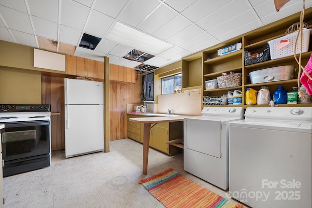 3407 14th Ave SW, Hickory, NC 28602 - laundry area with independent washer and dryer, light floors, and wood walls
