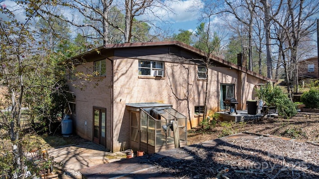 3407 14th Ave SW, Hickory, NC 28602 - view of home's exterior featuring brick siding, a patio area, and cooling unit