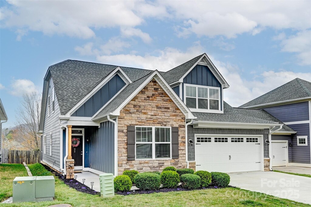 22 Hyde Park Pl, Arden, NC 28704 - craftsman-style house featuring stone siding, board and batten siding, and concrete driveway