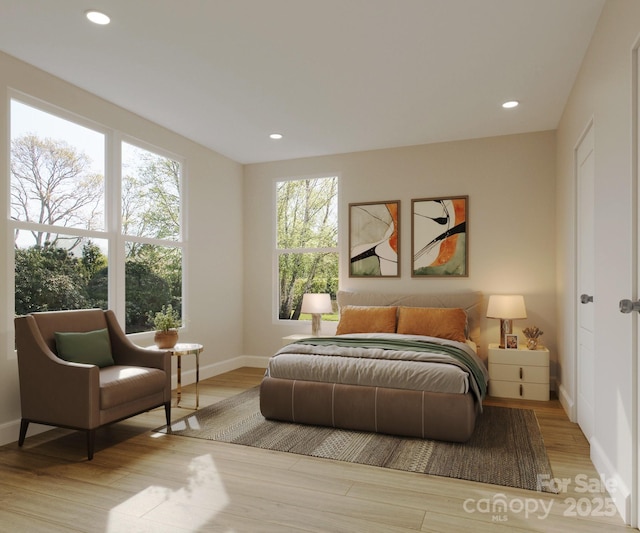 4969 Fitzgerald Ave, Charlotte, NC 28213 - bedroom with baseboards, wood finished floors, and recessed lighting