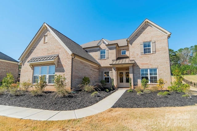 traditional-style home with brick siding