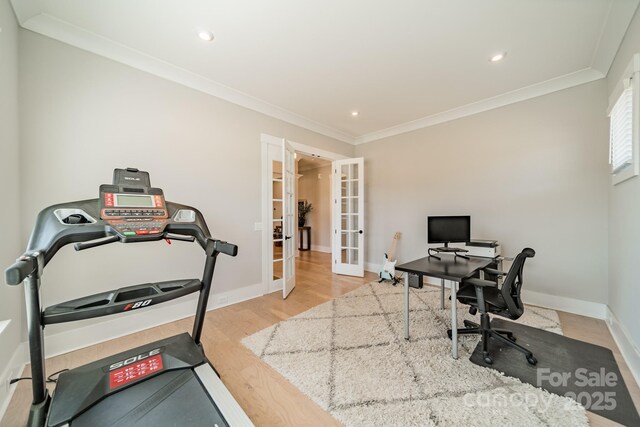 office featuring french doors, crown molding, baseboards, and wood finished floors