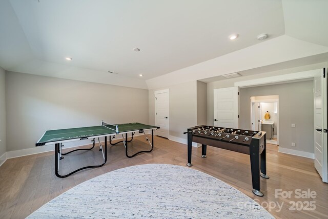recreation room featuring light wood finished floors, baseboards, and recessed lighting
