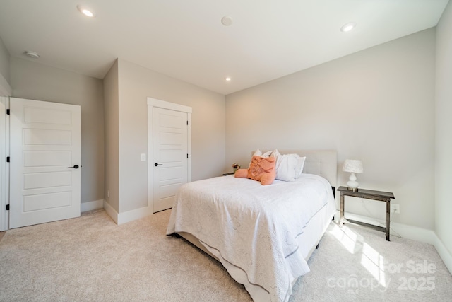 bedroom featuring baseboards, light colored carpet, and recessed lighting
