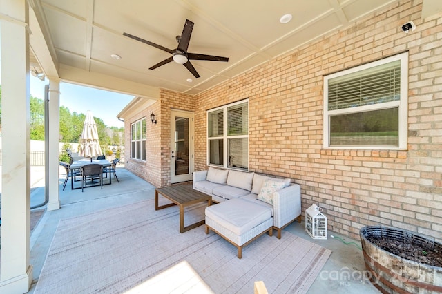 view of patio with outdoor lounge area, outdoor dining area, and ceiling fan