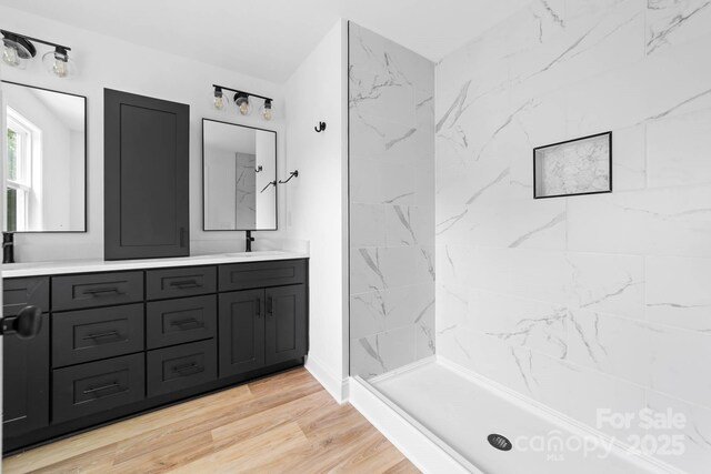 506 Legrand St, Shelby, NC 28150 - full bath featuring double vanity, a shower stall, and wood finished floors