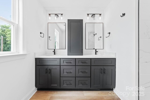 506 Legrand St, Shelby, NC 28150 - bathroom with double vanity, wood finished floors, and baseboards