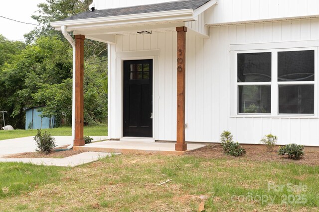 506 Legrand St, Shelby, NC 28150 - doorway to property featuring a shingled roof and a lawn