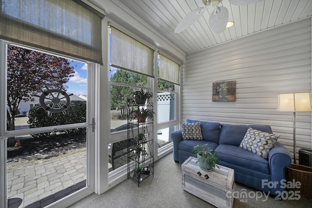 sunroom / solarium with an outdoor hangout area and ceiling fan