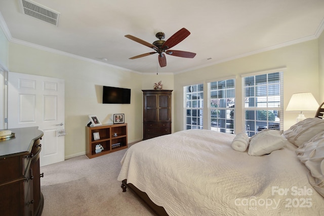 bedroom featuring baseboards, ornamental molding, visible vents, and carpet floors