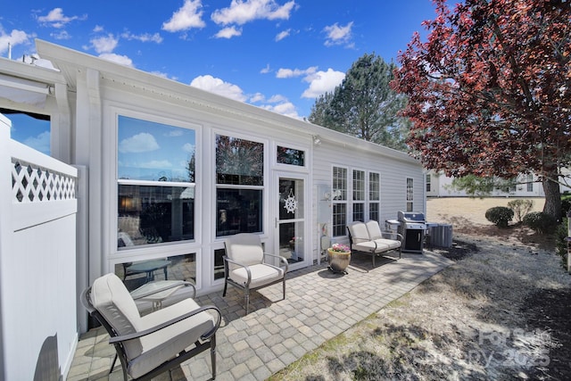 view of patio / terrace featuring central AC and a grill