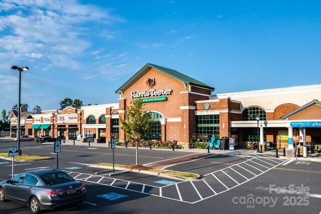 view of property featuring uncovered parking