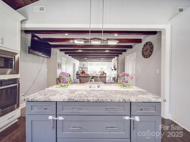 605 Allen Way, Indian Trail, NC 28079 - kitchen featuring appliances with stainless steel finishes, gray cabinets, dark wood-style floors, and beamed ceiling