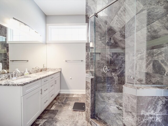 605 Allen Way, Indian Trail, NC 28079 - full bathroom featuring a shower stall, double vanity, marble finish flooring, and baseboards