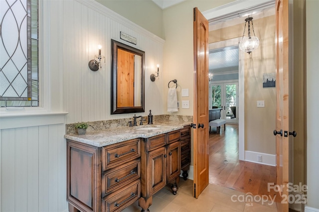 bathroom with tile patterned floors and vanity