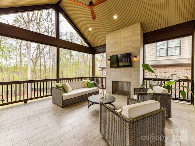 911 Abilene Ln, Fort Mill, SC 29715 - sunroom with ceiling fan, an outdoor living space with a fireplace, and lofted ceiling
