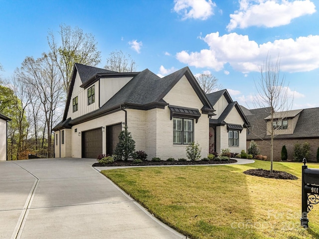 911 Abilene Ln, Fort Mill, SC 29715 - view of front of home featuring an attached garage, driveway, board and batten siding, and a front yard