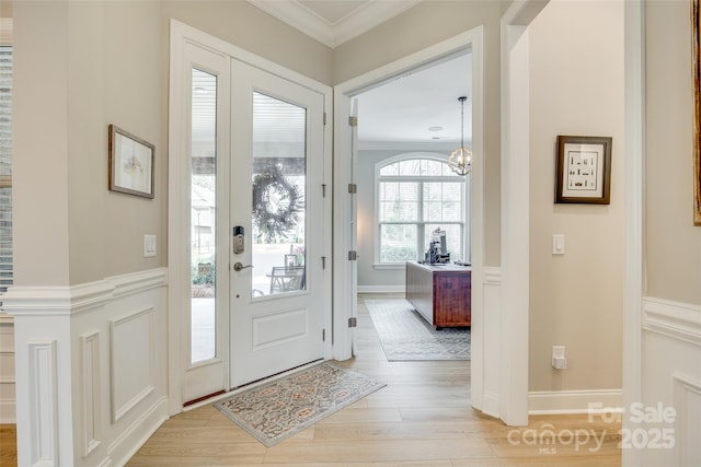 6207 Majesty Ct, Fort Mill, SC 29707 - foyer entrance featuring light wood-type flooring, ornamental molding, and a chandelier