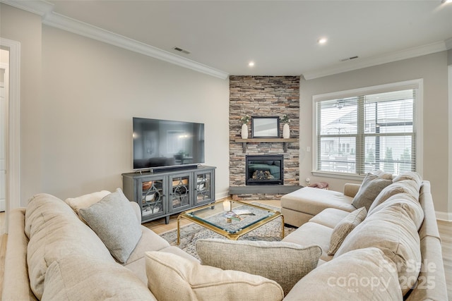 6207 Majesty Ct, Fort Mill, SC 29707 - living room featuring a stone fireplace, visible vents, crown molding, and wood finished floors
