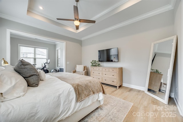 6207 Majesty Ct, Fort Mill, SC 29707 - bedroom featuring crown molding, light wood finished floors, baseboards, ceiling fan, and a tray ceiling