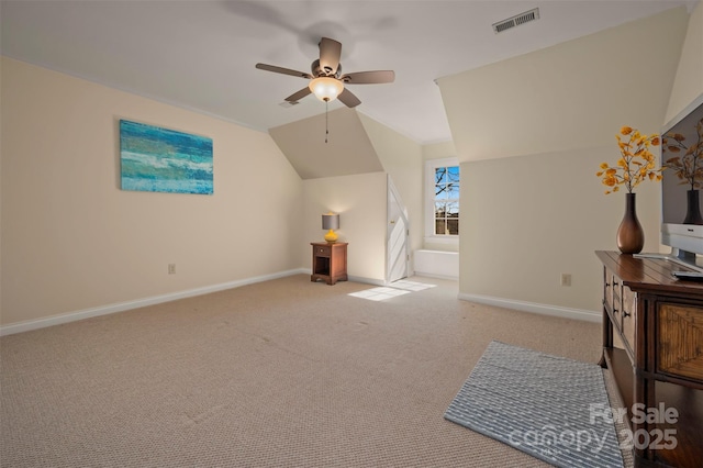 bonus room featuring lofted ceiling, carpet flooring, baseboards, ceiling fan, and visible vents