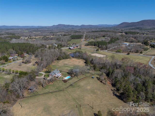 bird's eye view with a mountain view and a rural view