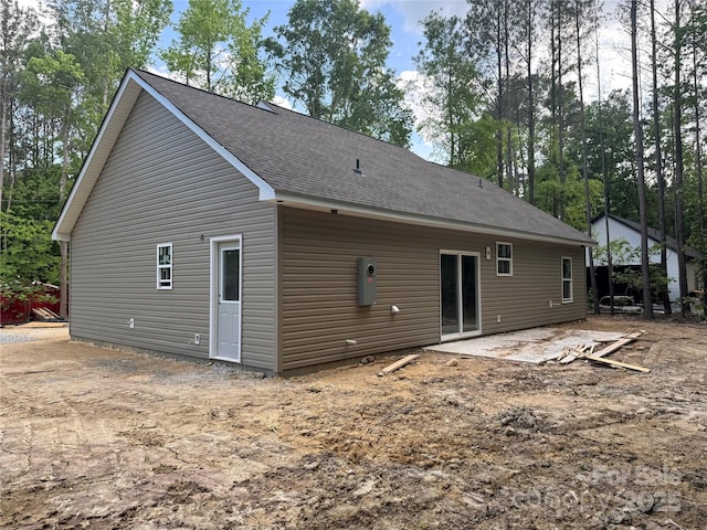 318 Stanback St, Mount Gilead, NC 27306 - rear view of property featuring a shingled roof and a patio area