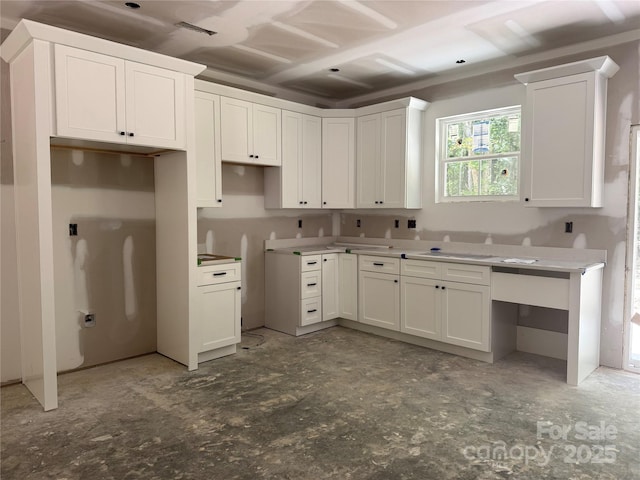 318 Stanback St, Mount Gilead, NC 27306 - kitchen with white cabinetry