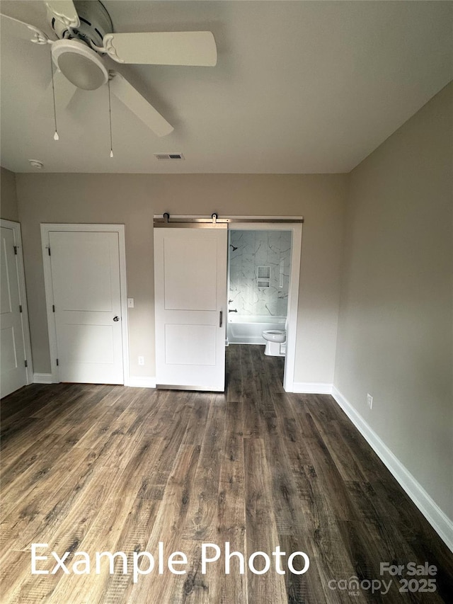 318 Stanback St, Mount Gilead, NC 27306 - unfurnished bedroom with wood finished floors and a ceiling fan