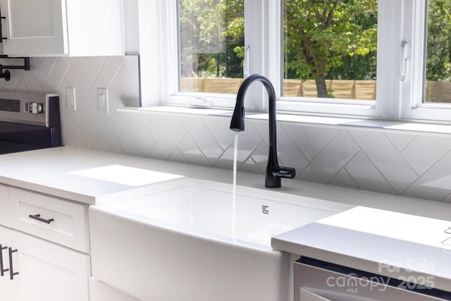 details with backsplash and a sink