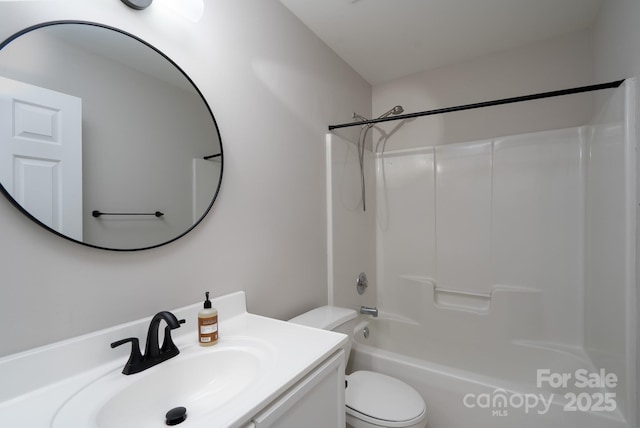 bathroom featuring tub / shower combination, toilet, and vanity