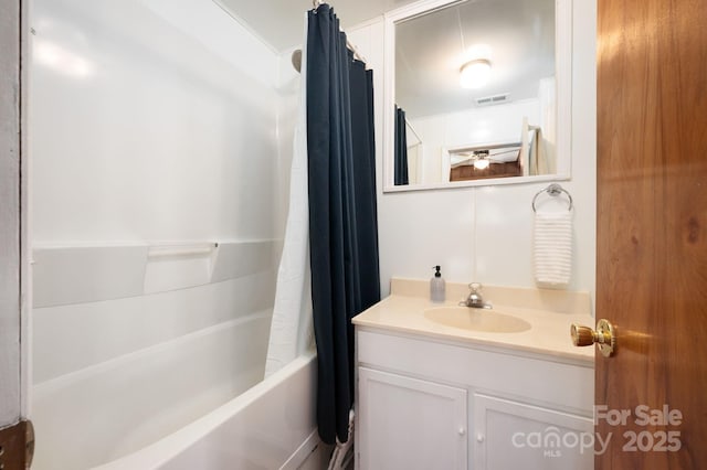 full bathroom with visible vents, vanity, and shower / bathtub combination with curtain