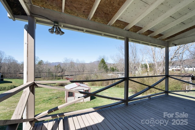 wooden deck with a yard