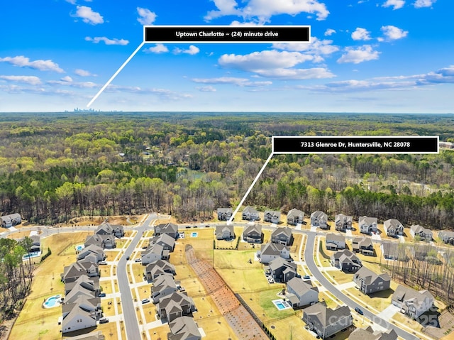 7313 Glenroe Dr, Huntersville, NC 28078 - aerial perspective of suburban area with a forest