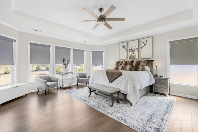 7313 Glenroe Dr, Huntersville, NC 28078 - bedroom with a tray ceiling, crown molding, wood finished floors, ceiling fan, and radiator heating unit