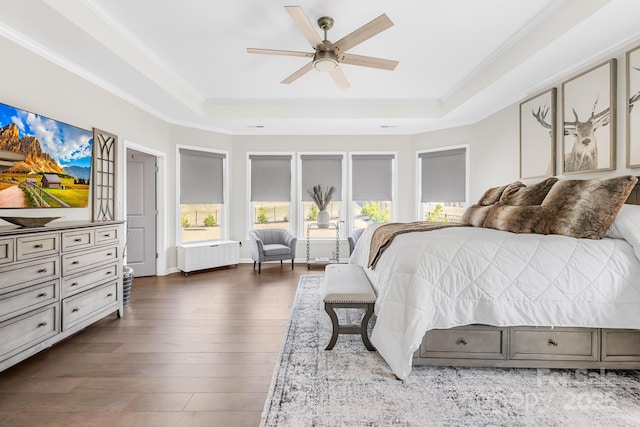7313 Glenroe Dr, Huntersville, NC 28078 - bedroom with a tray ceiling, ornamental molding, dark wood finished floors, and a ceiling fan