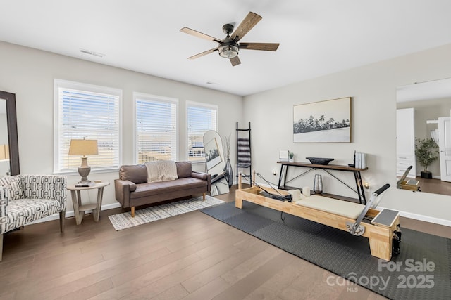 7313 Glenroe Dr, Huntersville, NC 28078 - workout room with a ceiling fan, wood finished floors, and baseboards