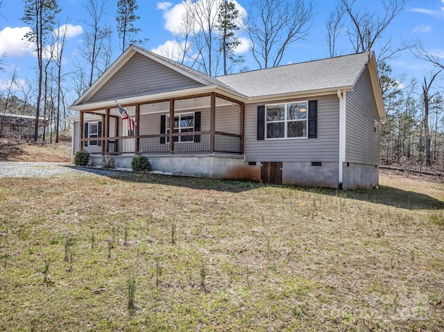 view of front of home with a front yard, roof with shingles, crawl space, and a porch