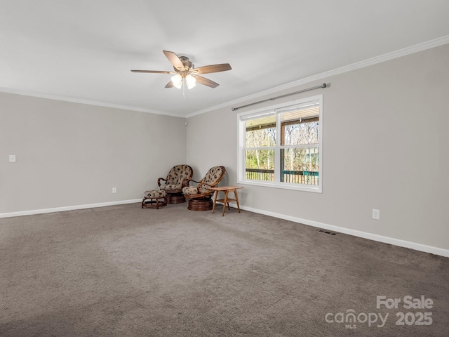 unfurnished room featuring a ceiling fan, carpet floors, ornamental molding, and baseboards