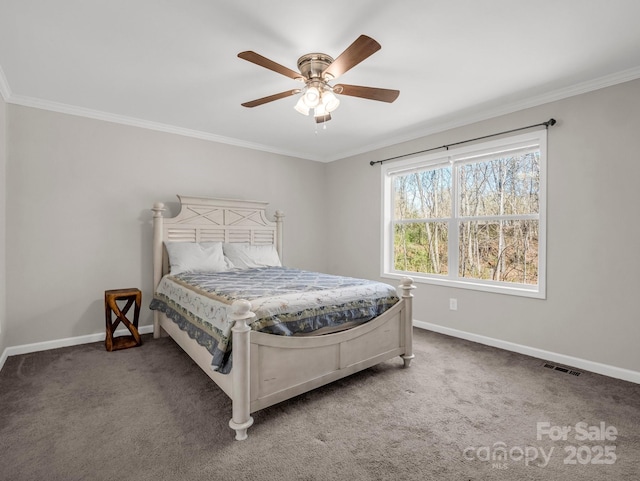 carpeted bedroom with baseboards, a ceiling fan, visible vents, and crown molding