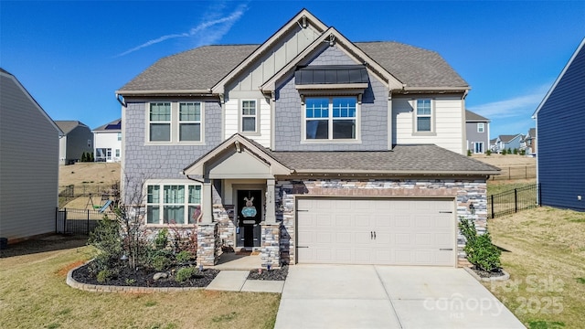 154 Rooster Tail Ln, Troutman, NC 28166 - craftsman house featuring board and batten siding, concrete driveway, an attached garage, and roof with shingles