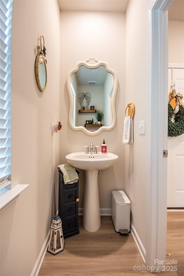 154 Rooster Tail Ln, Troutman, NC 28166 - bathroom featuring wood finished floors and baseboards