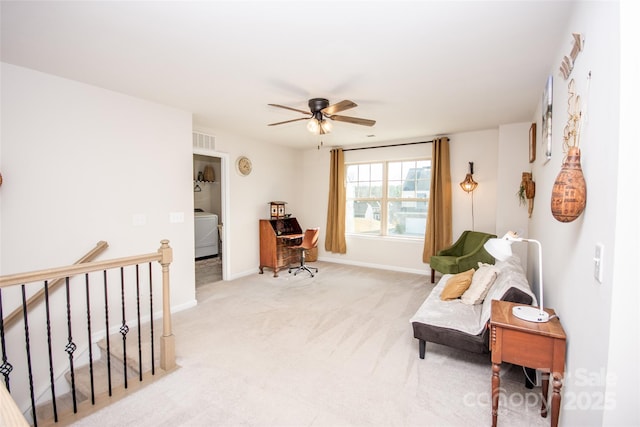154 Rooster Tail Ln, Troutman, NC 28166 - living area with washer / dryer, an upstairs landing, a ceiling fan, light carpet, and baseboards