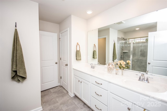 154 Rooster Tail Ln, Troutman, NC 28166 - bathroom featuring a stall shower, double vanity, and baseboards