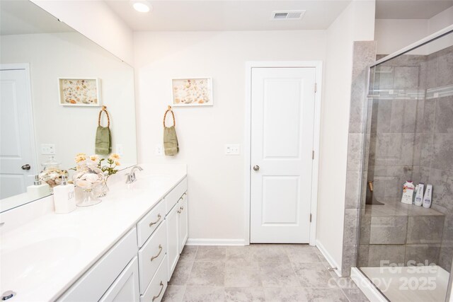 154 Rooster Tail Ln, Troutman, NC 28166 - full bathroom featuring a stall shower, double vanity, and baseboards