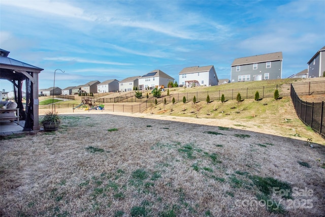 154 Rooster Tail Ln, Troutman, NC 28166 - view of yard featuring a residential view, a playground, a gazebo, and fence
