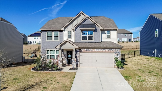 154 Rooster Tail Ln, Troutman, NC 28166 - craftsman house featuring board and batten siding, concrete driveway, an attached garage, and stone siding