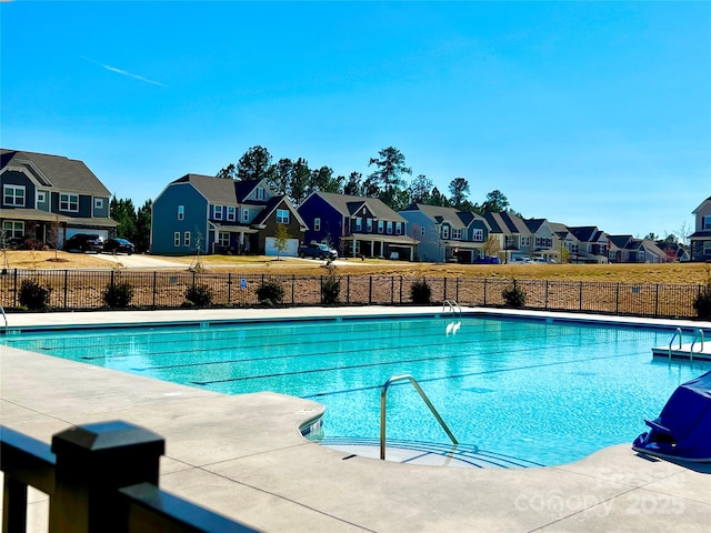 154 Rooster Tail Ln, Troutman, NC 28166 - community pool with a residential view and fence