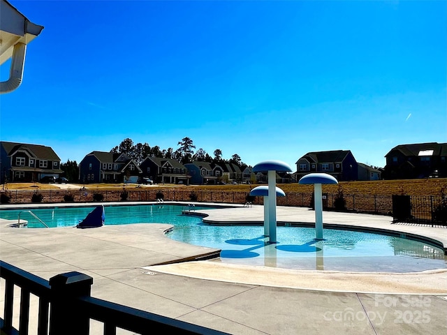 154 Rooster Tail Ln, Troutman, NC 28166 - community pool with a residential view, fence, and a patio area