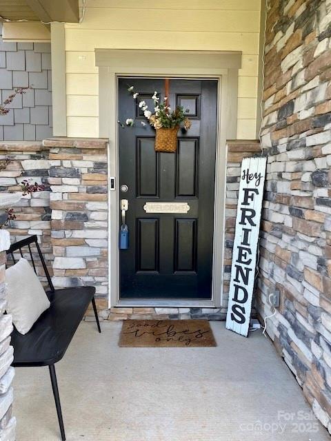 154 Rooster Tail Ln, Troutman, NC 28166 - doorway to property with stone siding